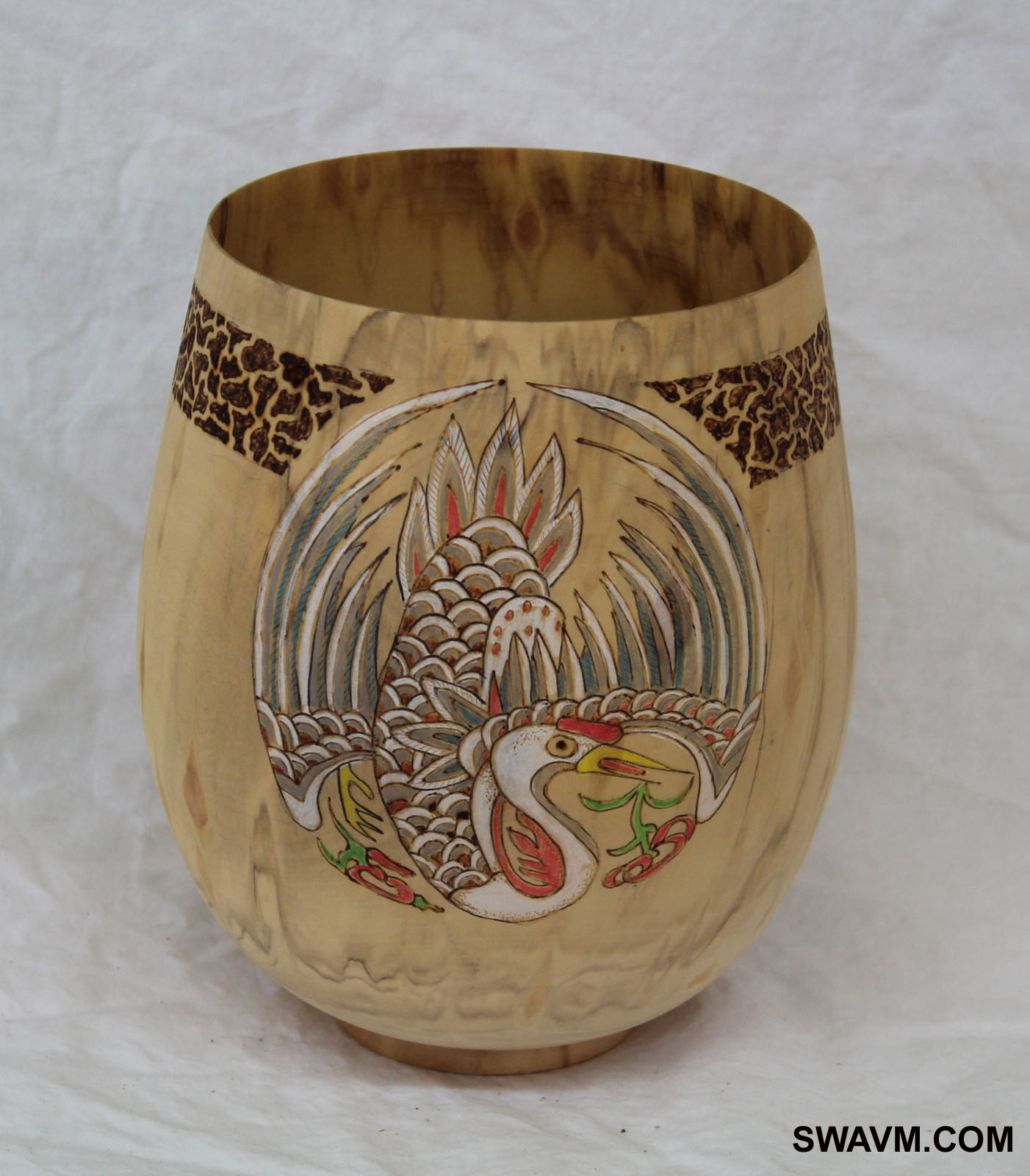 Woodburned and colored pencil used to create the Phoneix (bird) on a hand-turned Aspen Vase.